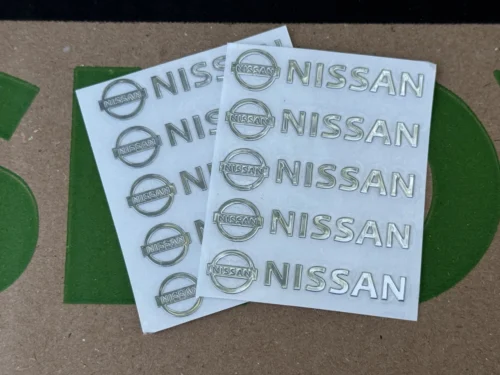 Набір металевих 3D наклейок Nissan (логотип + надпис, хром, 10 шт)